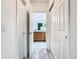 Hallway view featuring bathroom access with double closets on either side at 332 Blue Lake Cir, Kissimmee, FL 34758
