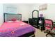 A themed bedroom with bright colors, a plush bed, and a study area at 332 Blue Lake Cir, Kissimmee, FL 34758