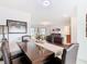 Open dining area featuring an elegant table setting, seamlessly connected to the living space at 332 Blue Lake Cir, Kissimmee, FL 34758