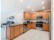 Open kitchen with stainless steel appliances, granite countertops, and ample cabinet space at 332 Blue Lake Cir, Kissimmee, FL 34758