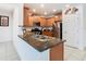 Bright kitchen with stainless steel appliances, granite countertops, and ample counter space at 332 Blue Lake Cir, Kissimmee, FL 34758