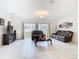 Bright living area with tile floors and comfortable seating arrangement at 332 Blue Lake Cir, Kissimmee, FL 34758