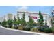 Commercial property featuring a T.J. Maxx storefront and well-maintained landscaping at 332 Blue Lake Cir, Kissimmee, FL 34758