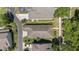 Aerial view showcasing a home's roof, backyard, and surrounding landscaping in a residential neighborhood at 336 Sunset Oaks Rd, Winter Garden, FL 34787