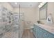 Sleek bathroom featuring a walk-in shower, contemporary vanity with dual sinks, and elegant fixtures for a spa-like experience at 336 Sunset Oaks Rd, Winter Garden, FL 34787