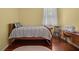 Bright bedroom with hardwood floors, a comfortable single bed, and a window with natural light at 336 Sunset Oaks Rd, Winter Garden, FL 34787