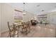 Open-concept living space showcases dining area leading into a living room filled with natural light at 336 Sunset Oaks Rd, Winter Garden, FL 34787