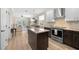 The eat-in kitchen boasts a center island, stainless appliances, and easy access to the living area and patio at 336 Sunset Oaks Rd, Winter Garden, FL 34787