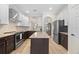 The spacious kitchen has stainless steel appliances, lots of counter space, and an island for food prep at 336 Sunset Oaks Rd, Winter Garden, FL 34787