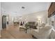 Bright and airy living room with hardwood floors, comfortable seating, and an open layout perfect for entertaining guests at 336 Sunset Oaks Rd, Winter Garden, FL 34787
