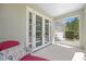This patio offers outdoor seating and a serene view of the well-maintained landscaping and the home's exterior at 336 Sunset Oaks Rd, Winter Garden, FL 34787