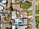 Aerial view of a neighborhood featuring pools, solar panels, and well-maintained yards at 340 Zelda Blvd, Daytona Beach, FL 32118