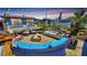 Outdoor patio with fire pit, comfortable seating and mature landscaping at 340 Zelda Blvd, Daytona Beach, FL 32118