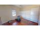Bedroom featuring hardwood floors, a ceiling fan, and a bright window at 340 Zelda Blvd, Daytona Beach, FL 32118