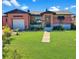 Charming brick home with a well-maintained lawn and inviting front entrance at 340 Zelda Blvd, Daytona Beach, FL 32118