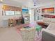 Eclectic living space with a fireplace, dining area, and colorful decor, perfect for entertaining at 340 Zelda Blvd, Daytona Beach, FL 32118