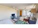 Cozy living area featuring a comfortable sofa, a television, and natural light at 340 Zelda Blvd, Daytona Beach, FL 32118