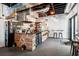 Restaurant interior featuring a modern counter area with a television, open ceiling and seating at 397 Shoreview Sands Ave, Mascotte, FL 34753