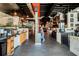 Spacious restaurant interior with multiple serving areas, TV screens, modern lighting, and a welcoming atmosphere for customers at 397 Shoreview Sands Ave, Mascotte, FL 34753