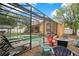 This house is perfect for outdoor entertaining, with a screened pool area and comfortable lounge seating at 400 Shelby Ct, Apopka, FL 32712