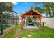 This gazebo offers a great place to relax, featuring comfortable seating and easy access to the screened in pool at 400 Shelby Ct, Apopka, FL 32712