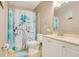 Well-lit bathroom featuring a shower with a charming shower curtain, toilet and vanity at 400 Shelby Ct, Apopka, FL 32712