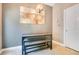 Cozy dining area featuring modern table and bench seating, complemented by stylish light fixture at 400 Shelby Ct, Apopka, FL 32712
