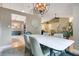 Bright dining area with modern table and chairs, showcasing an open-concept layout at 400 Shelby Ct, Apopka, FL 32712