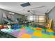 Spacious game room features a basketball game, arcade games, ping pong, and colorful floors at 400 Shelby Ct, Apopka, FL 32712