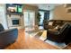 Inviting living room with a fireplace, wood floors, and a comfortable seating arrangement at 400 Shelby Ct, Apopka, FL 32712
