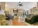 Comfortable living room with fireplace, plush seating, and access to outdoor living at 400 Shelby Ct, Apopka, FL 32712