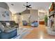 Inviting living room with cozy seating, fireplace, and ample space for entertaining at 400 Shelby Ct, Apopka, FL 32712