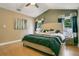 Spacious main bedroom with vaulted ceiling, ceiling fan, and two sunny windows with pleasing curtains at 400 Shelby Ct, Apopka, FL 32712