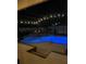 Backyard pool and spa illuminated at night, perfect for relaxation and outdoor enjoyment at 400 Shelby Ct, Apopka, FL 32712
