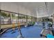 Large enclosed lanai with fitness equipment and seating area, perfect for exercise and relaxation at 401 Sanford Ave, Longwood, FL 32750
