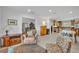 Inviting living room featuring neutral decor, tile floors, and an open floor plan leading to the kitchen at 401 Sanford Ave, Longwood, FL 32750