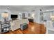 Open-concept living room with hardwood floors, comfortable seating, and stylish décor at 401 Sanford Ave, Longwood, FL 32750