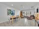 Bright living room featuring neutral tile flooring, natural light, and comfortable seating for a relaxing ambiance at 401 Sanford Ave, Longwood, FL 32750