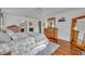 Bright main bedroom with hardwood flooring and plenty of closet space at 401 Sanford Ave, Longwood, FL 32750