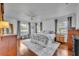 Spacious main bedroom featuring hardwood flooring, natural light, and a ceiling fan at 401 Sanford Ave, Longwood, FL 32750