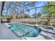 Sparkling screened-in pool and spa with tile accents, surrounded by a spacious patio and lush landscaping at 401 Sanford Ave, Longwood, FL 32750