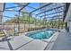 Beautiful screened-in pool with spa and gray patio furniture offering an inviting outdoor space at 401 Sanford Ave, Longwood, FL 32750