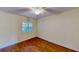 Bedroom featuring hardwood floors and a window at 408 E Orlando Ave # 2A, Ocoee, FL 34761
