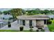 Community clubhouse features a stone accent wall, neutral paint, and beautiful lake views at 408 E Orlando Ave # 2A, Ocoee, FL 34761