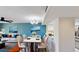 Elegant dining area featuring a modern chandelier and bright, open layout at 408 E Orlando Ave # 2A, Ocoee, FL 34761