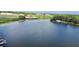 Tranquil lake view with tree-lined shore, clear water, and peaceful atmosphere at 408 E Orlando Ave # 2A, Ocoee, FL 34761