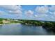 Expansive lake view featuring a clear blue sky, lush greenery, and serene water at 408 E Orlando Ave # 2A, Ocoee, FL 34761