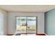 Bright living space with sliding glass doors to a lanai and water views at 408 E Orlando Ave # 2A, Ocoee, FL 34761