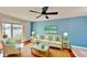 Cozy living room with a view of the water from the sliding glass doors to the balcony at 408 E Orlando Ave # 2A, Ocoee, FL 34761
