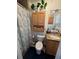 Cozy bathroom with shower, decorative cabinets, tiled walls, and vessel sink on granite counter at 415 N Fern Creek Ave, Orlando, FL 32803